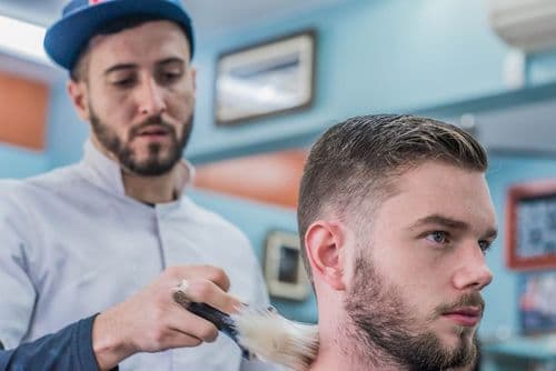 Charity Haircuts Bring Dignity at Homeless Football Event
